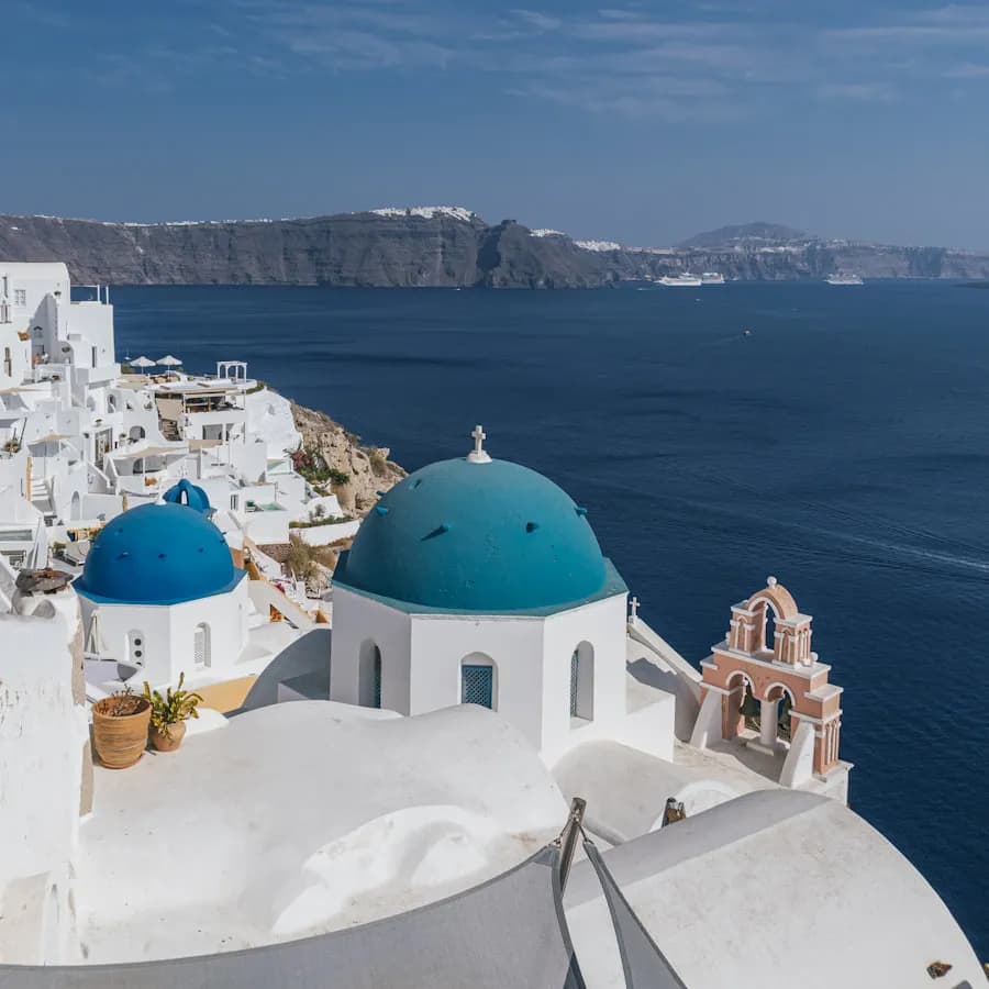 Blue-domed churches above the caldera in Oia, Santorini